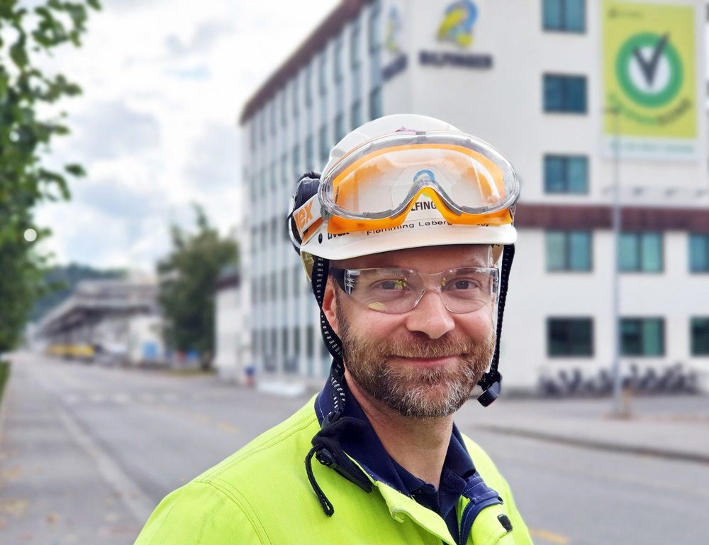 man standing in the street in industrial park