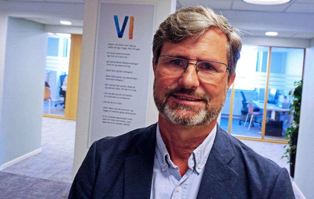 portrait man, glasses, beard, office environment